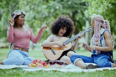 Friends at picnic in park